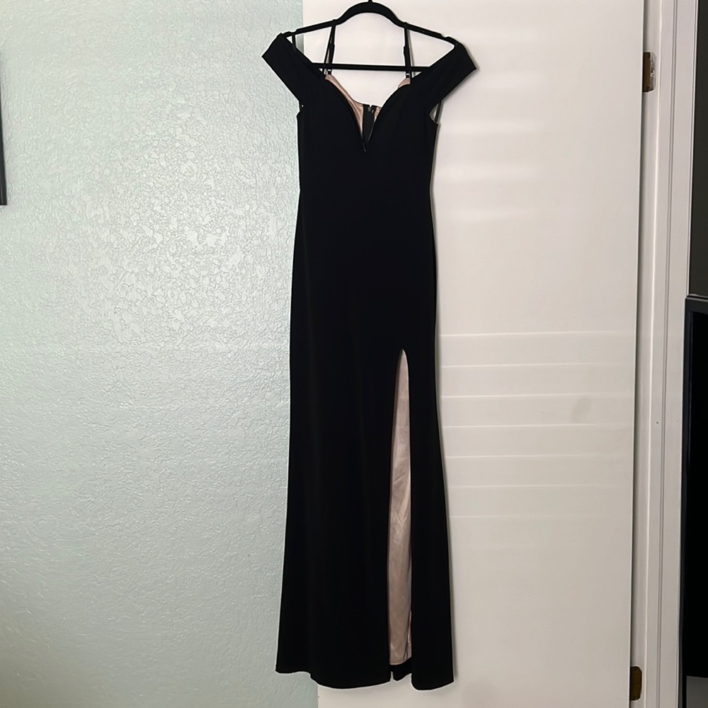 Long black sweetheart neck line, slit size 7